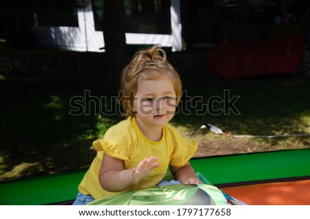 Similar – Happy little girl playing in a urban playground.