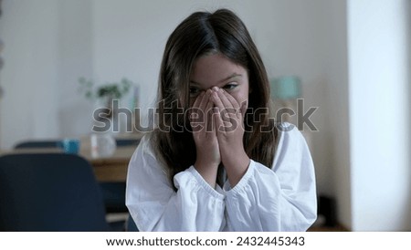 Little girl baffled reaction by covering mouth and face with hands feeling surprised and unbelief. Child in shock Portrait