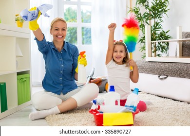 Little Girl And Beautiful Mom Cleaning Room