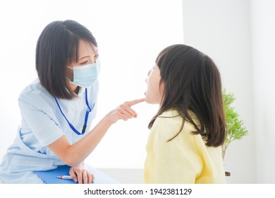 A little girl being treated by a dentist - Powered by Shutterstock