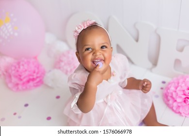 little girl black on white background. baby's first birthday
