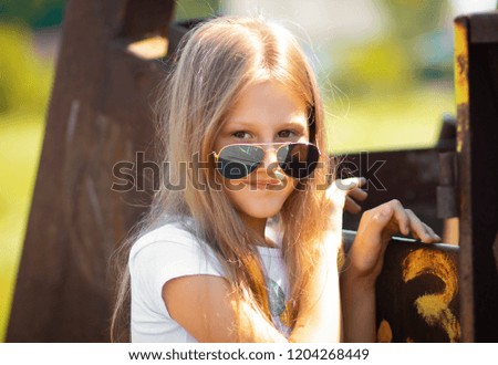 Little girl blonde with glasses