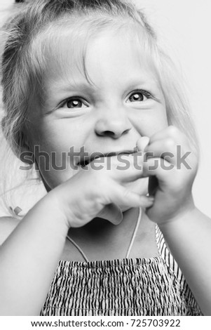 Little girl, blonde, laughs, close-up