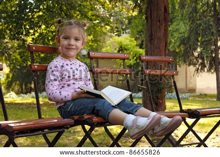 grandma reading a book to a child