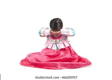 Little Girl Bow Down In Korea Traditional Clothes.