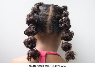 Little girl with  Boxer braids, African hair style also known as "Kanekalon braids." Close up on hairstyle.