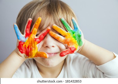 little girl and boy hands painted  in colorful paints - Shutterstock ID 181432853