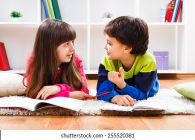 Little Girl And Little Boy Have Decided To Take A Break From Homework And Now They Are Having Conversation.Children Talking