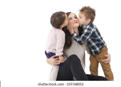 Little Girl And Boy Kissing Their Mother