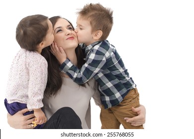 Little Girl And Boy Kissing Their Mother