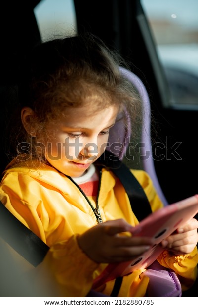 A little girl in\
the car. Trip. Journey.