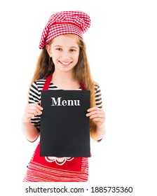 Little girl in chef uniform holding menu mockup with copy space in hands isolated on white background - Shutterstock ID 1885735360