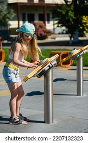 Little Girl Child School Age Play And Learn With Modern Interactive Toy At Playground Park In Summer.