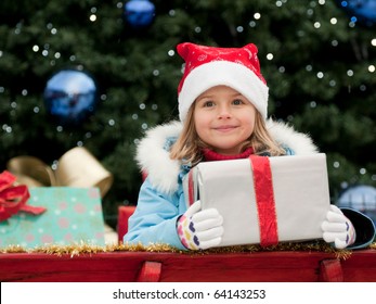 Little girl in Christmas sledge
