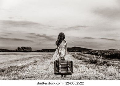 little girl with suitcase