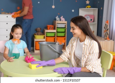 Little girl cleaning her room with mother - Shutterstock ID 1511910107