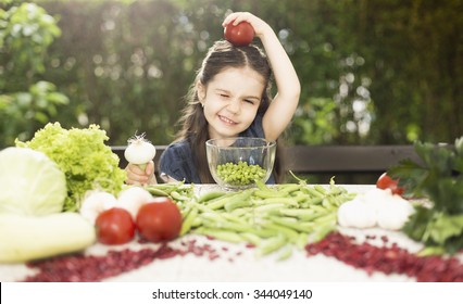 
Little Girl Cleaning Peas And Recommend You To Eat Healthy Food