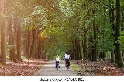 Little Girl Cycling With Her Mother In Holland
