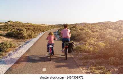 Little Girl Cycling With Her Mother In Holland
