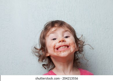 Little Girl Is Dirty With Chocolate. Funny Face