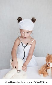 little girl doctor with teddy bear