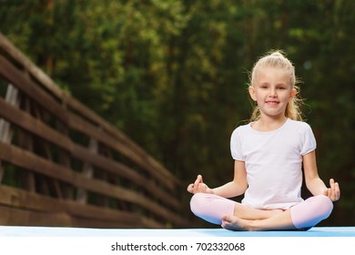 Little Girl Doing Yoga Outdoor Stock Photo 702332068 | Shutterstock