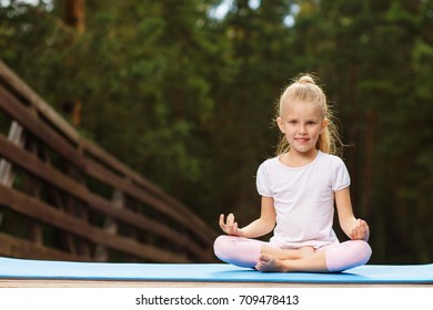 Little Girl Doing Fitness Outdoor Stock Photo (Edit Now) 709477807