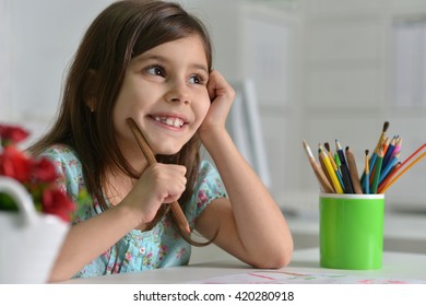 Little Girl Drawing At Home