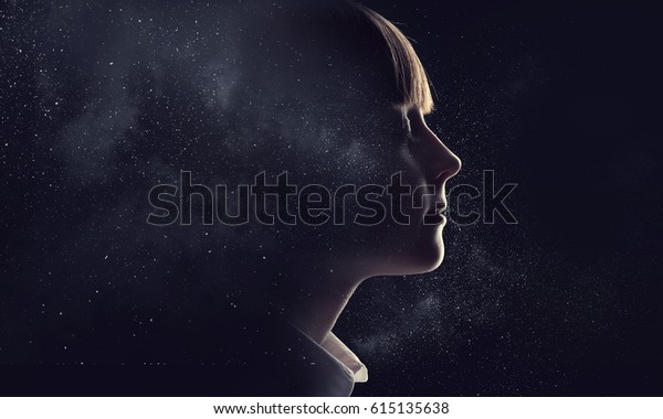 little girl with closed hands at face