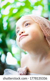 Little Girl Dressing Up In A Ballerina Costume. Asian Toddler Pretend Play.