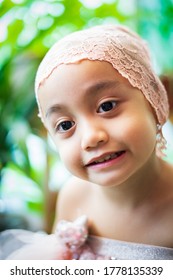 Little Girl Dressing Up In A Ballerina Costume. Asian Toddler Pretend Play.