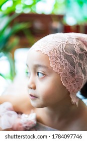 Little Girl Dressing Up In A Ballerina Costume. Asian Toddler Pretend Play.