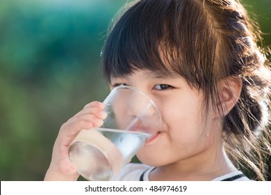 Little Girl Drinking Water