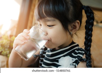 Little Girl Drinking Water