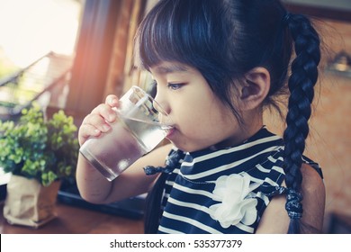 Little Girl Drinking Water