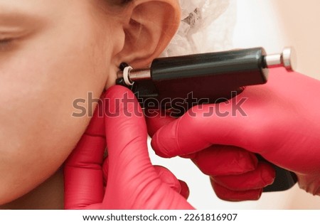 little girl during an ear piercing