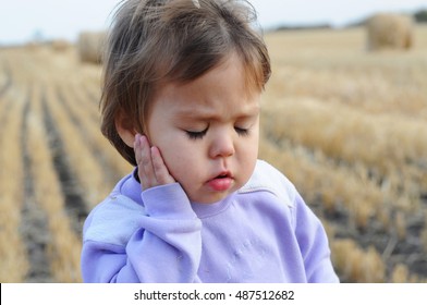 Little Girl With Ear Pain Moaning Holding Hand On Ear, Child Headache Pain, Health Care Concept, Ear Protection From Cold, Kid Catch Cold In Cold Season, Hearing Loss,