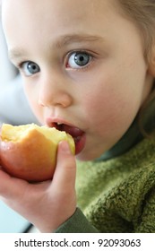 Little Girl Eating Apple