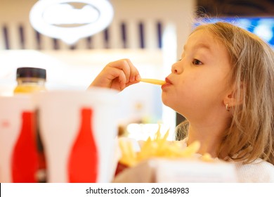 Little Girl Eating Fast Food 