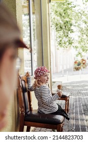 Little Girl Eating Italian Ice Cream With Her Sister On Summer Day At Street Italian Cafe, Candid Kid