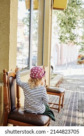 Little Girl Eating Italian Ice Cream With Her Sister On Summer Day At Street Italian Cafe, Candid Kid