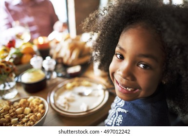 Little Girl Eating Thanksgiving Celebration Concept
