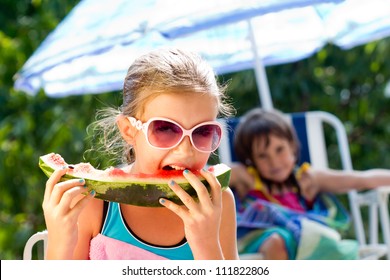 Little Girl Eating Watermelon In Very Hot Summer Day