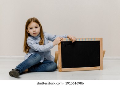 Little Girl And Empty Place On A Board 