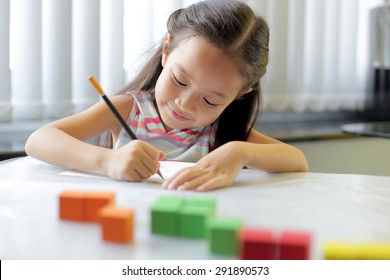 A little girl enjoying her learning at school - copy space available