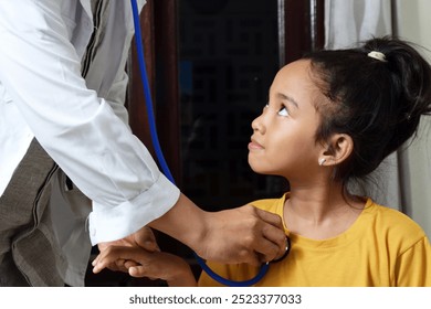 A little girl is examined by a doctor using a heart monitor. This is done to find out about the child's health and provide guidance. SHOTLISThealth - Powered by Shutterstock