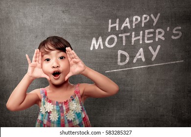 Little girl expression with happy mothers day greeting on background. Mothers day Concept.