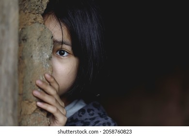 Little girl with eye sad and hopeless. Human trafficking and fear child concept.  - Shutterstock ID 2058760823