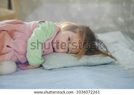 Similar – Little girl smiling lying over the bed