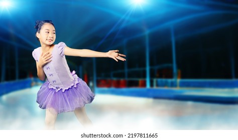 Little Girl Figure Skating On A Skating Rink. Figure Skating Competition. Ice Show.